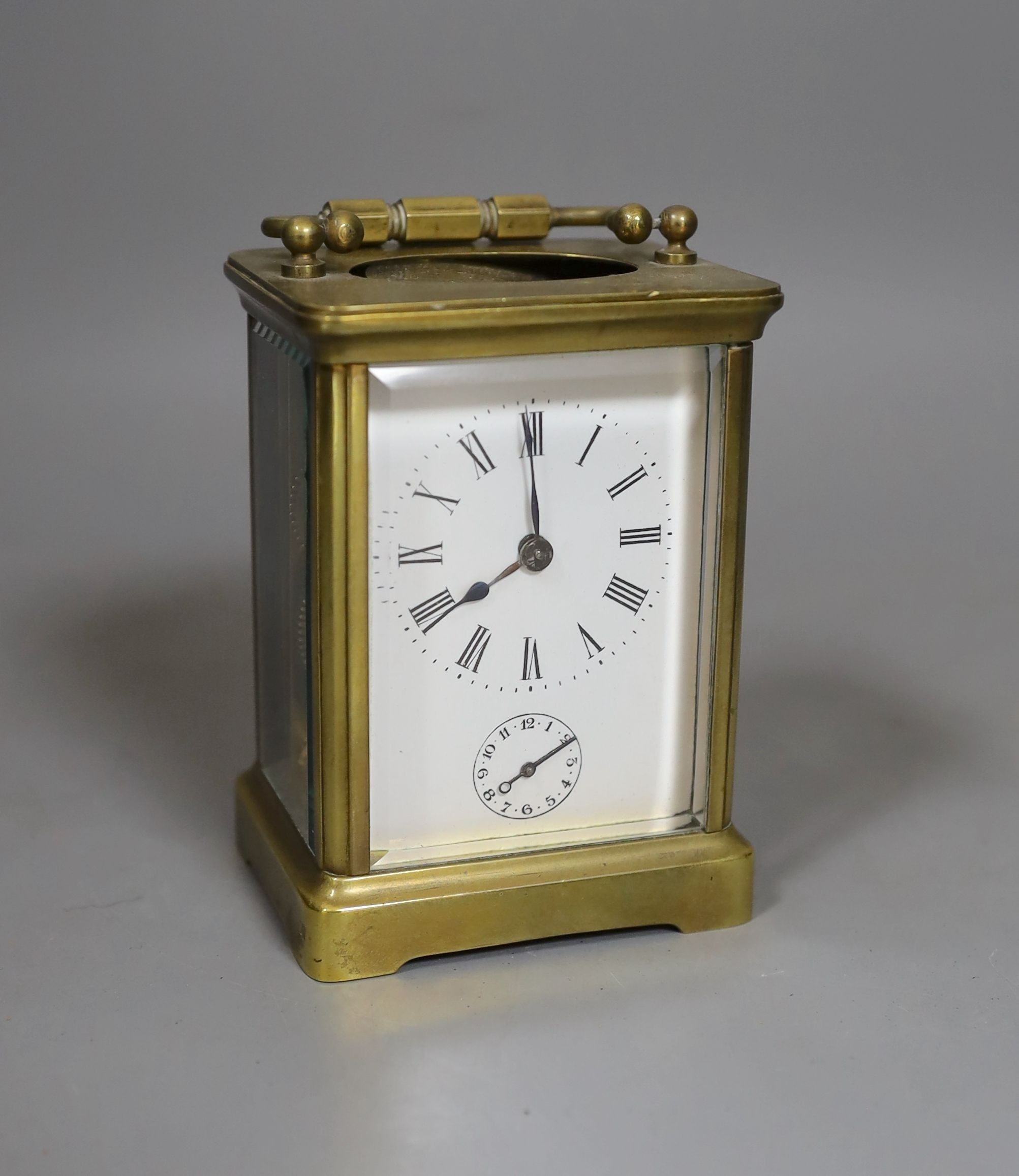 A carriage clock with alarm, 10.5 cms high.